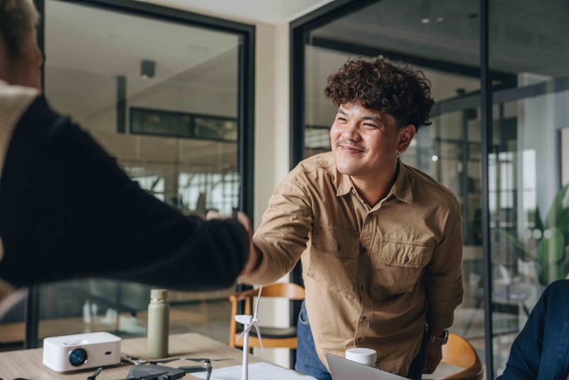 People shaking hands and smiling