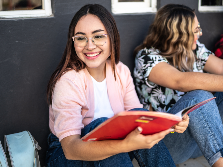 Student looking through notebook