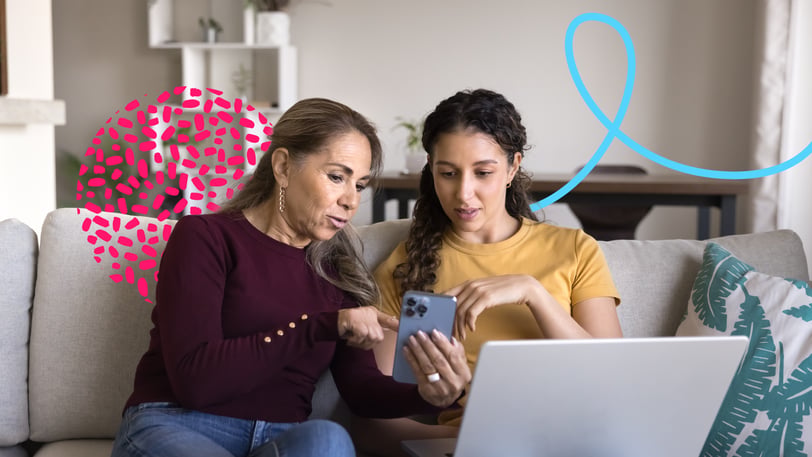 An older woman and a young woman sitting on a couch, looking at a smartphone together, with abstract pink and blue graphic elements overlaid.