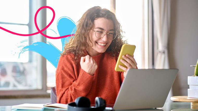 Happy female college student cheering with phone after winning a scholarship.
